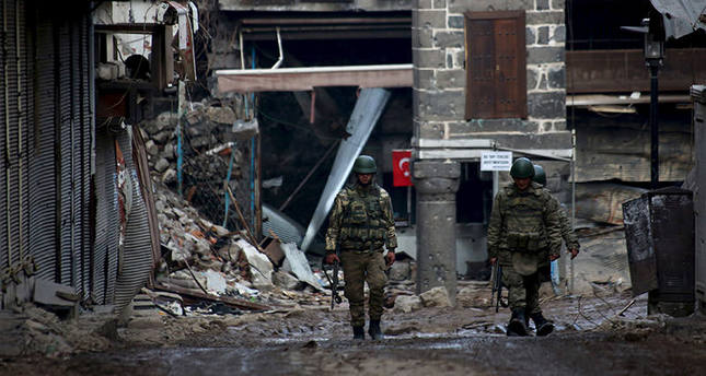 Turkish soldiers patrol in Sur district, which is partially under curfew, in the Kurdish-dominated southeastern city of Diyarbakir, Turkey February 26, 2016. REUTERS/Sertac Kayar