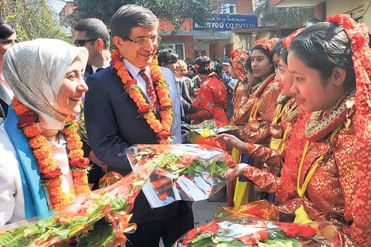 Foreign Affairs Minister Ahmet Davutoglu is with students at the Turkish School in Kathmandu, Nepal