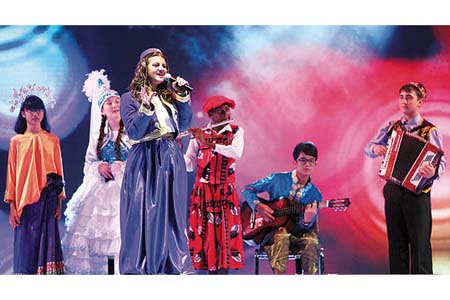 Students taking part in the 11th International Turkish Language Olympiad sing songs together at the event’s opening ceremony in Ankara on Saturday night. (Photo: Today's Zaman)