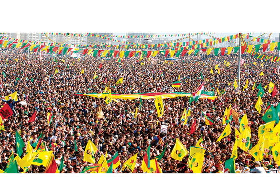 Demonstrators hold Kurdish flags in Diyarbakır on March 21, when the terrorist PKK announced a cease-fire as part of ongoing settlement negotiations. (Photo: İHA, Ahmet Ün)