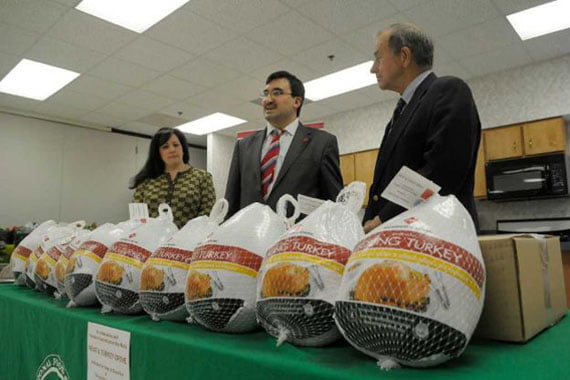 Joanne Dwyer, left, director of food industry relations and business development for the Regional Food Bank of Northeastern New York, Veysel Ucan, center, executive director of the Turkish Cultural Center Albany, and State Assemblyman Bob Reilly take part in a press event at the Regional Food Bank of Northeastern New York, on Tuesday, Nov. 22, 2011 in Albany, NY. Members of the Turkish Cultural Center Albany donated 500 pounds of packaged beef cutlets and turkeys to the food bank in celebration of the Muslim holiday Feast of Sacrifice, Eid ul Adha and for the Thanksgiving holiday. Ucan said that the donation was a way for the Turkish American community to show their shared values for the whole community. Dwyer said that they send items to 1,000 non-profits in 23 counties and through those organizations 250,000 people are helped each year. 