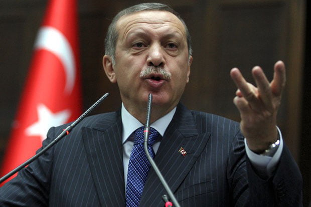 Turkish Prime Minister Recep Tayyip Erdogan addresses lawmakers at the parliament in Ankara, Turkey, Tuesday, Nov. 26, 2013.