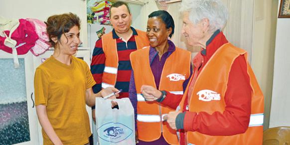 Volunteers Sherri Outler (left) and Margot Marshall (right) helped distribute aid packages to families in need during Eid al-Adha. (Photo: Cihan)