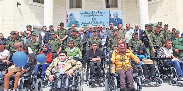 The charity Kimse Yok Mu recently delivered electric wheelchairs to 25 handicapped Palestinians in Hebron. (Photo: Cihan)