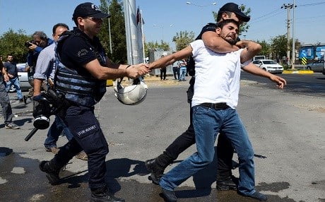 Turkish police detain a teacher during a protest in Diyarbakir in September. Photo: Ilyas Akengin/AFP