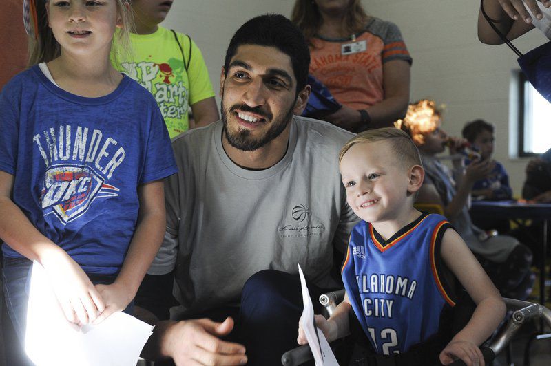 OKC Thunder's Enes Kanter takes a picture with Henry Hale during his visit at the J.D. MacCarty Center Thursday, March 23, 2017