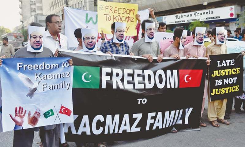 STAFF members of Pak-Turk School’s campus in Karachi on Saturday stage a protest demonstration outside the Karachi Press Club for the recovery of the Kacmaz family, who were recently picked up in Lahore and taken away to an unknown location. —Fahim Siddiqi / White Star