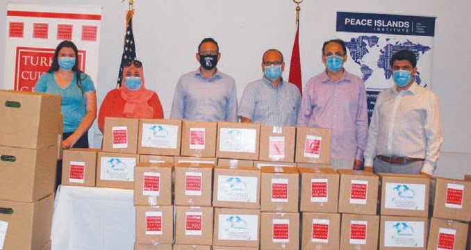 Mayor Brian Arrigo (center) stands with members and officials from the Turkish Cultural
Center behind care packages filled with meats, supplied by the Turkish Cultural Center and
fresh produce, provided by the City, set to be delivered to families in need in the city as part of the TCC’s Food Drive for Eid al Adha (Feast of Sacrifice).